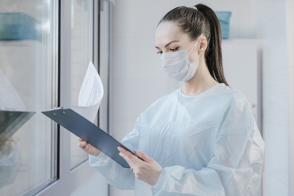 Hospital pharmacist reviewing phenobarbital protocol documentation with attending physician at nursing station