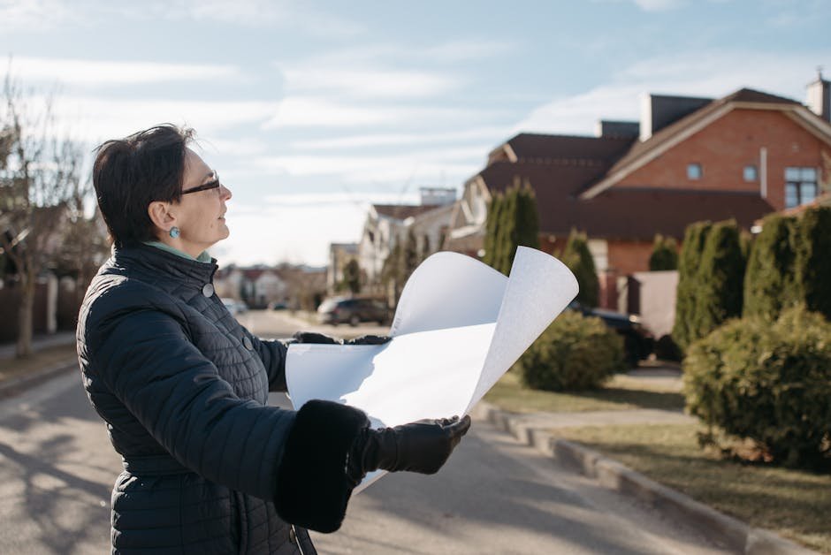 VA case manager reviewing housing voucher paperwork with a veteran in transitional housing