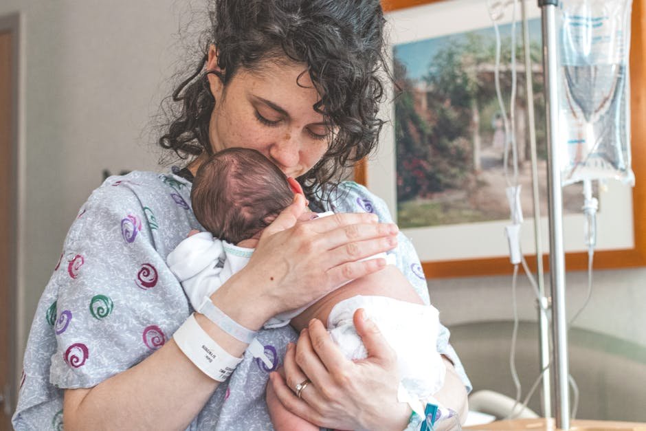Mother-baby psychiatric unit room with newborn bassinet and supportive care environment